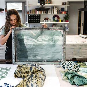 Textiles student with screen and fabric