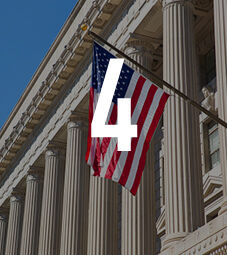 Law School - Homepage - Why Choose Us Flip Card - American Internship Programme - American flag outside a town hall