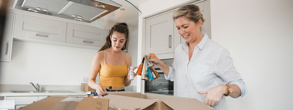 Parent helping student unpack