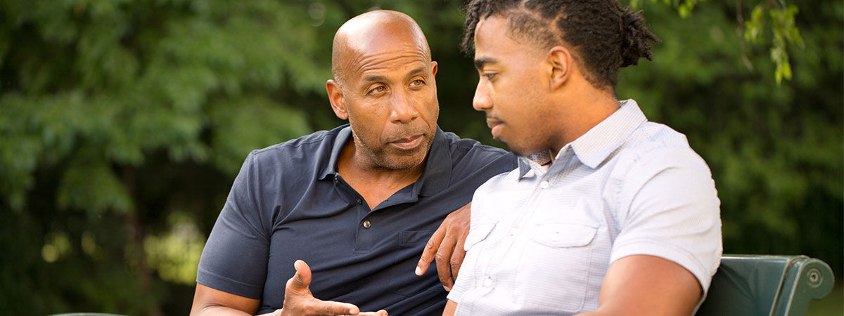 Parent giving advice to son