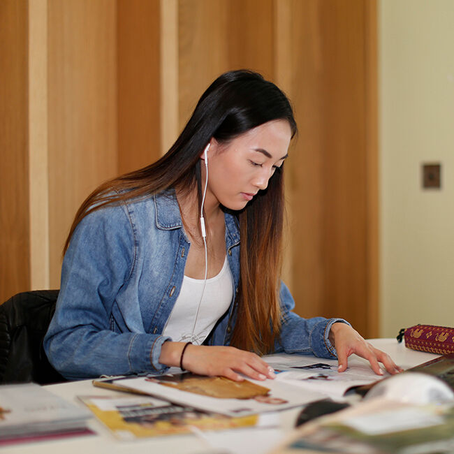 student at work in library