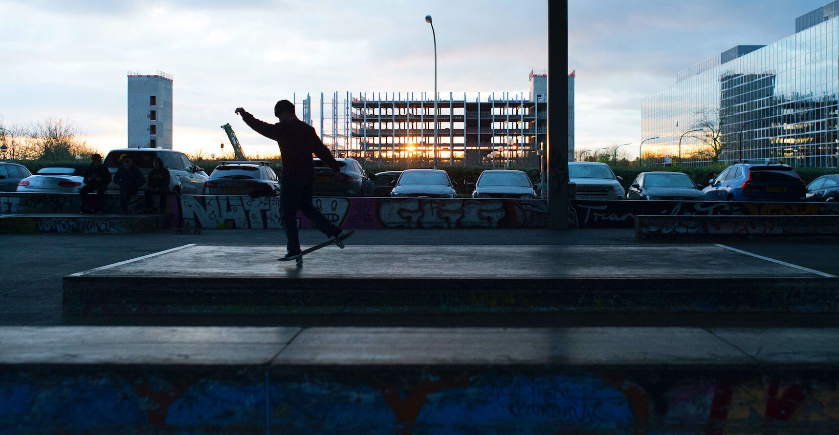 Image of Alex (skateboarder) silhouette at sunset in the city
