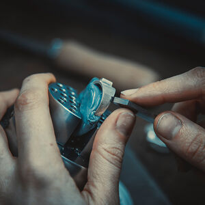 Close up of student's hands creating a ring