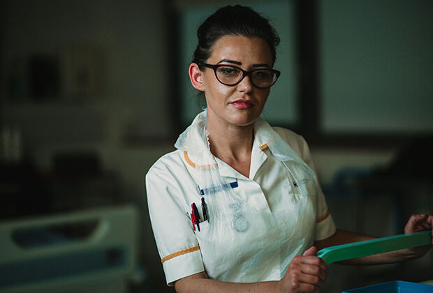 Student nurse dressed in uniform in hospital setting