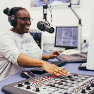 A student using the radio studio