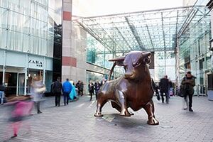 An exterior photo of the famous bull sculpture outside the Bullring shopping centre