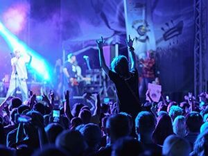 Crowds dance at a live entertainment venue