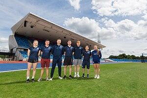 A BCU sports team poses for a photo in the Alexander Stadium