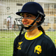 BCU female cricket player in sports hall