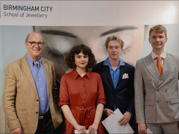 Competition winner and BCU student Marcus Laing (third from left) alongside runners up receiving their prizes from Christopher Ward CEO Mike France (left of group)