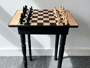 A table made of a chess board by student David Lucas