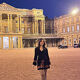 Emaleigh Conn stood outside Buckingham Palace at night