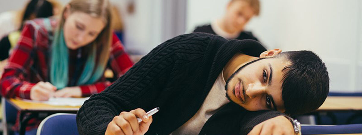 Student with head on hands during at exam