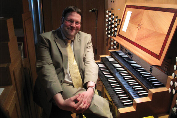 Organist Henry Fairs sat at the organ in 2014