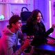 Two people play video games together