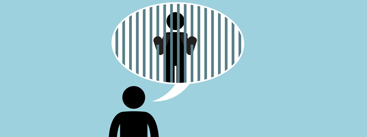 HMP Grendon Article 1200x450 - Cartoon man with a speech bubble featuring a man behind bars