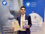 Professor Islam Issa holding the prestigious Anglo-Hellenic League Runciman Award 2024 and his book Alexandria: The City That Changed the World. 