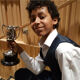 Junior Conservatoire student Jeevan Braich holding trophy