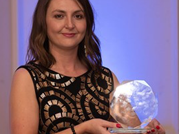 Jenna Langford holding award from RTPI