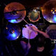 Image of a drummer playing their drum kit