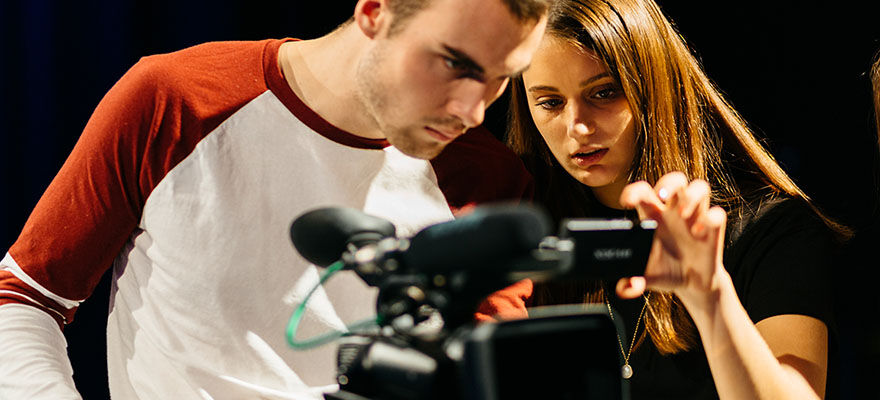 Media students using camera equipment