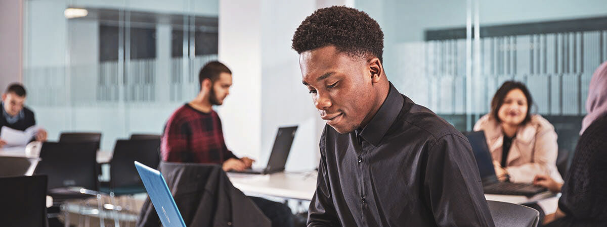 Business School Campaign Images - Accounting 1200x450 - People in a classroom