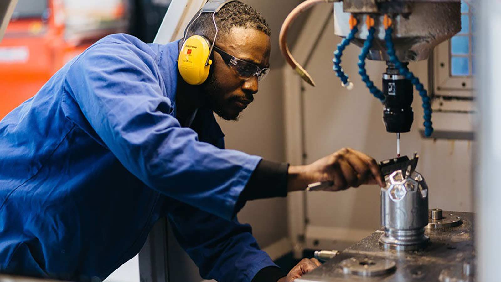 Manufacturing engineering student uses equipment