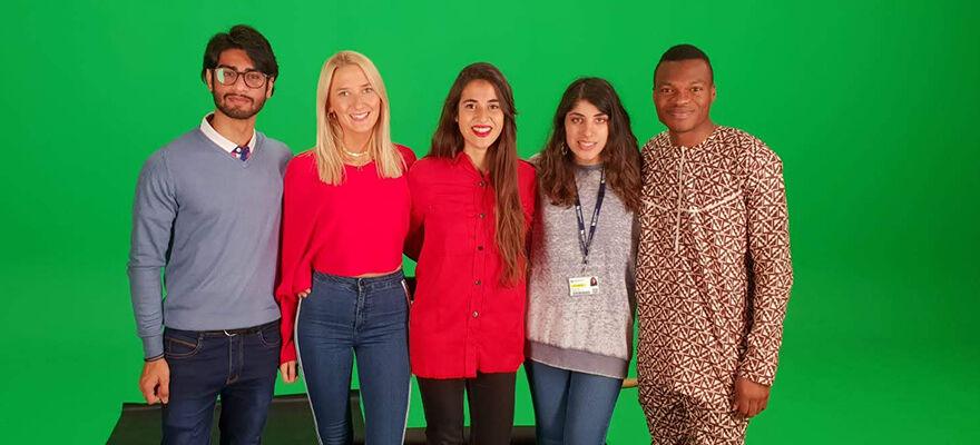 Students in the green screen studio filming for the We are International video.