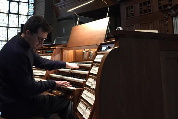 Organist Nicholas Wearne sat at the organ