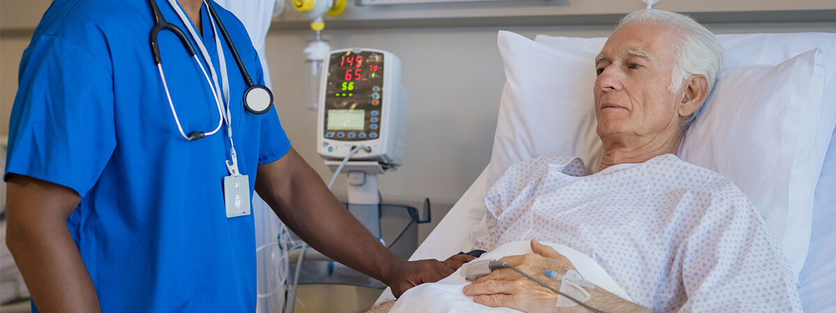 An elderly patient having his medication adjusted in hospital.