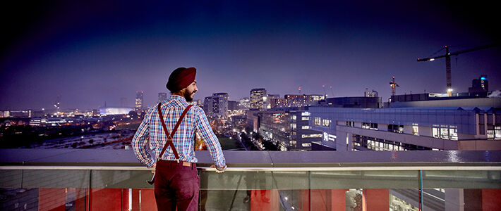 Student looking out over Birmingham skyline