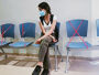 Female teenager isolated in a waiting room