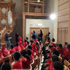 Primary school pupils sat looking at organ