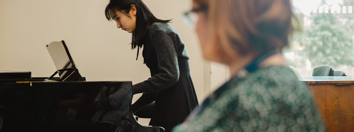 Student playing piano