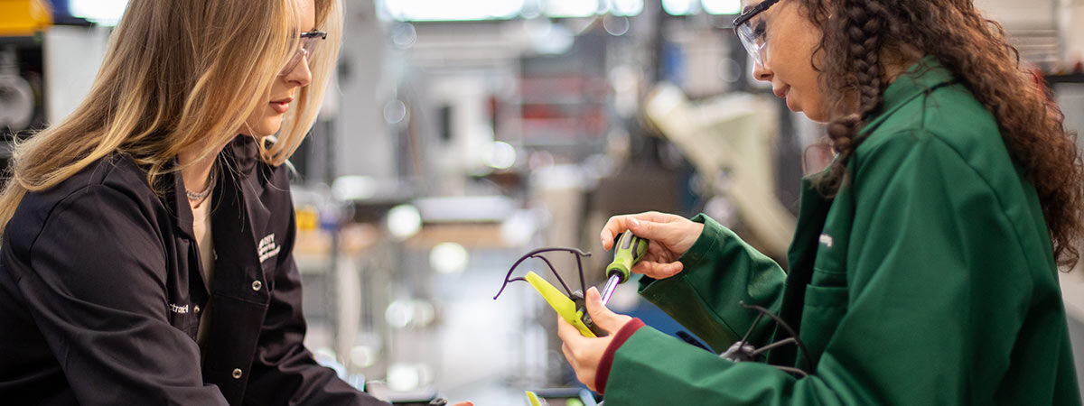 Two Electronic Engineering students building electronic project