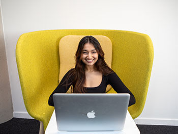 Smiling student with laptop