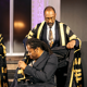 Sir Lenny Henry CBE presents Ade Adepitan MBE with his ceremonial robe