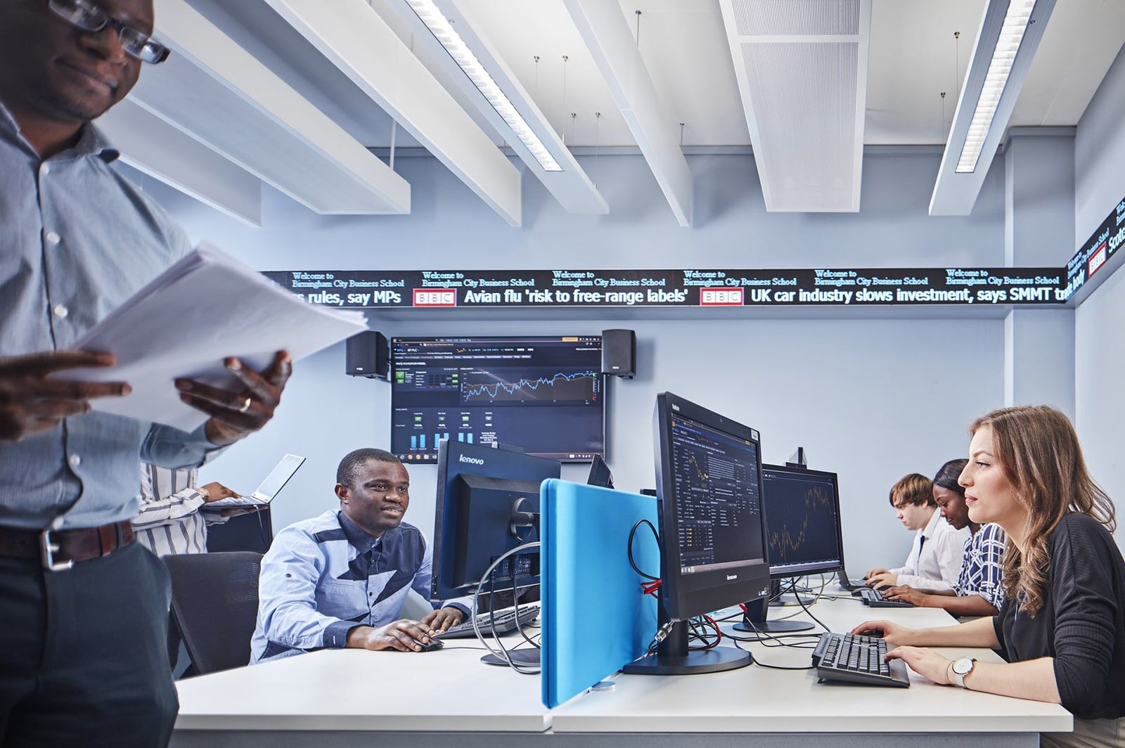 Business students work in the City Trading Room