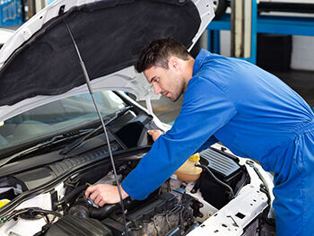 mechanic working on car