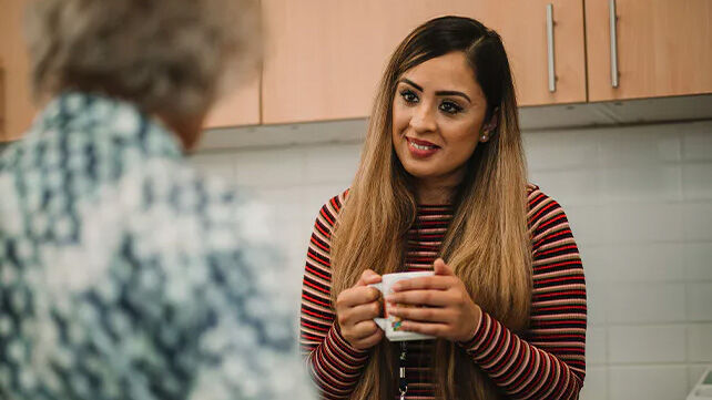 Student chatting over a cup of tea 