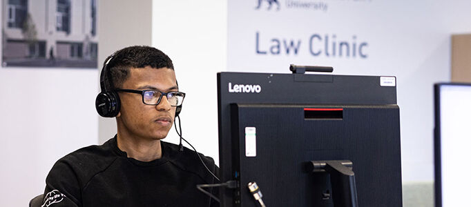 Student at desk at BCU law clinic