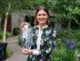 Ula Maria holding her engraved vase for the Best in Show award at the RHS Chelsea Flower Show