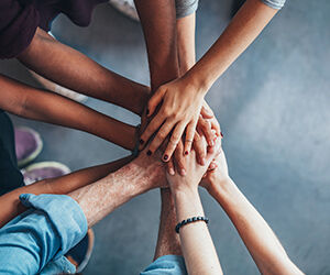 School of Law - Research - Research Projects - University Research Collaborations Image 300x250 - People holding hands