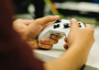 Image of a person holding a game controller